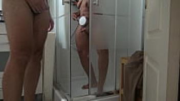 TABOO FAMILY: While watching his stepmother take a morning shower, the voyeur stepson masturbate.