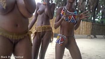 Three witches from an African tribe are performing a dance ritual to create rain.