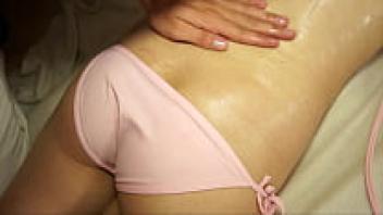 During a relaxing massage, a very attractive brunette becomes aroused and sucks the masseuse's firm dick.