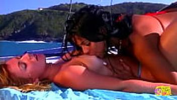 Beautiful brunette and her bikini-clad lesbian pal used a sex toy to have sex outside