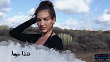 Taya Vais, a slim Russian MILF, displays her toned physique while nude outside.