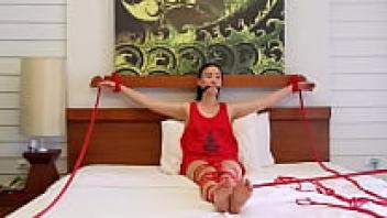 Red ropes used for Sofi Bondage on the bed