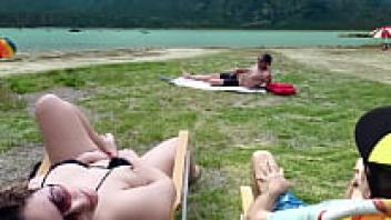 While I touch myself, Voyeur masturbates on the beach.