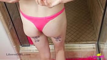 In 4K, a blonde with tattoos and a trim, attractive figure takes a seductive shower.