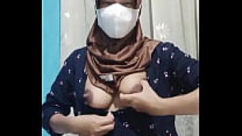 When the home is silent, a lovely student wearing a hijab masturbates.