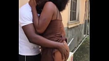 An actual sex tape shows a man making love to his neighbor's wife in the backyard before bringing her inside for a passionate kiss (full video on RED).