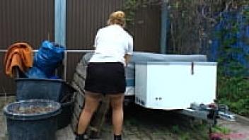 Handling a large, firm dick, this attractive, older blonde wears stockings and glasses.