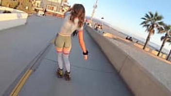 Body-painted roller girl at the beach