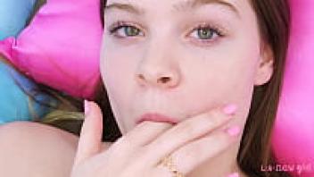 Close-up of a teenage brunette in the nude