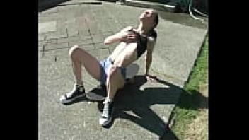 Zoe, an amateur skater, flashes her pussy and reveals her pierced breasts.