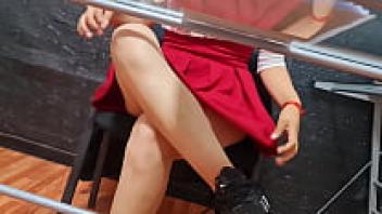 Nataly, a Mexican insurance salesperson, displays her hair in an upskirt.