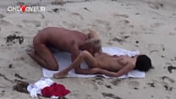 Voyeur Beach. A well-proportioned teenager having sex on a public beach