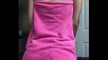 A slender, attractive adolescent flaunting her nude body