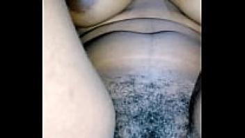 African lady letting hairy pussy out.