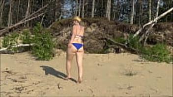 Bikini with white, yellow, red, and blue on the beach